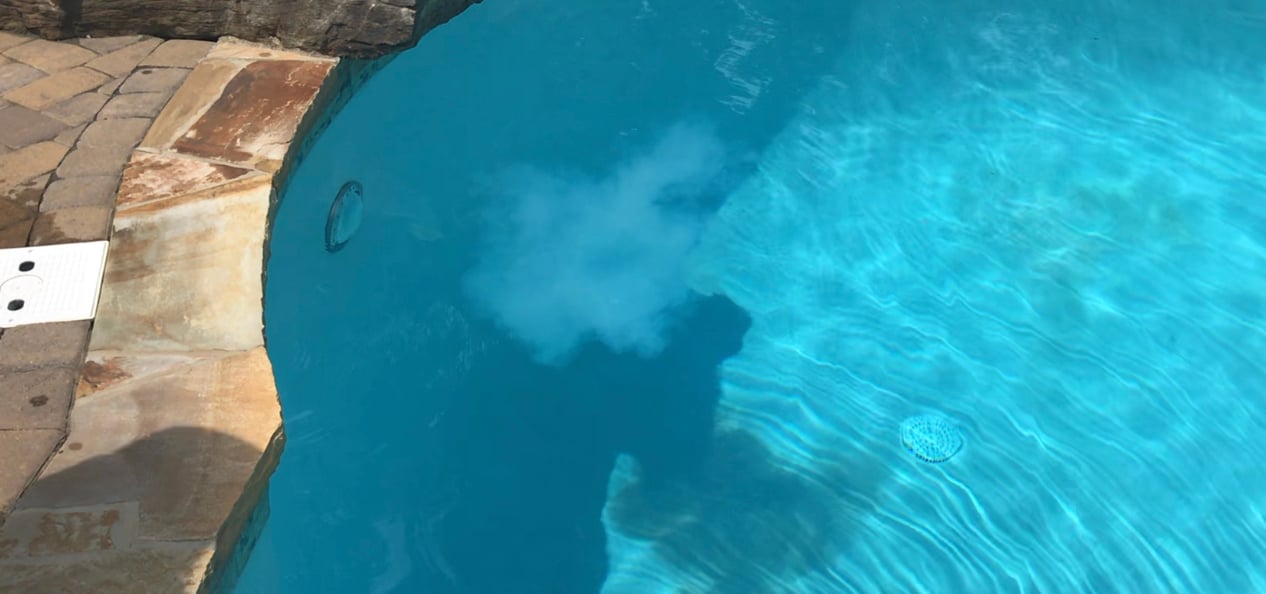 PR-10,000 red cap test, small cloud showing phosphates are present in the pool