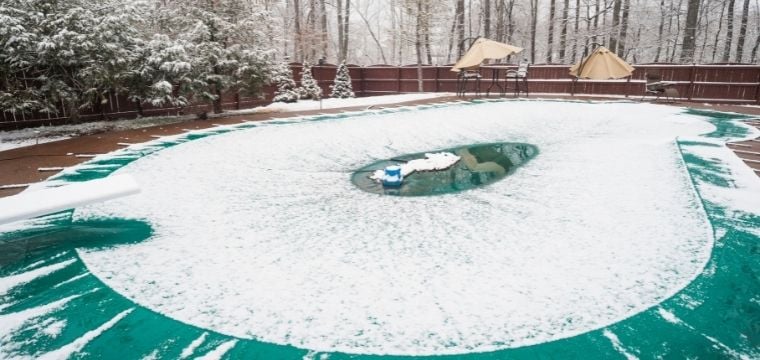 covered swimming pool covered in snow and ice
