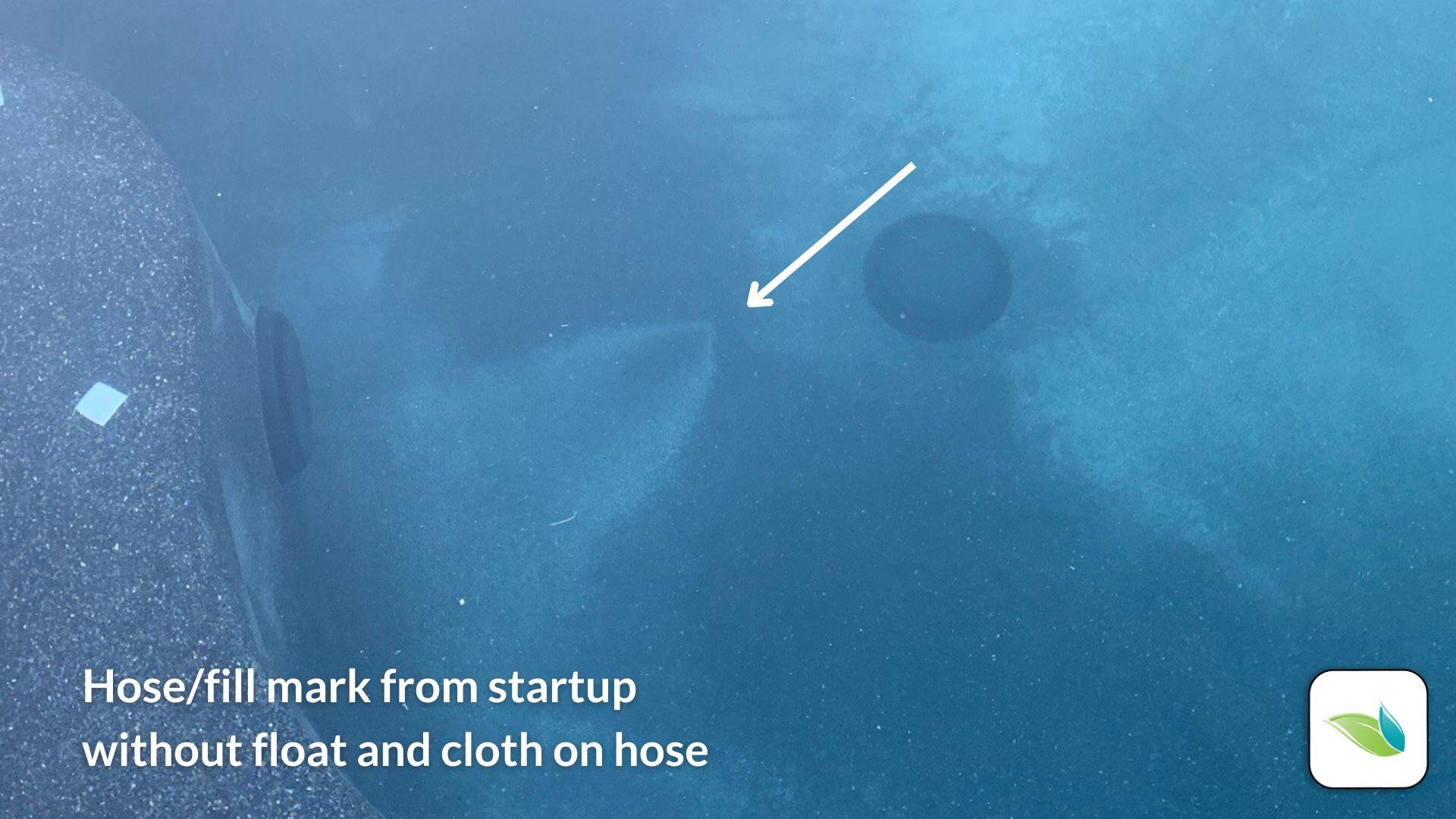 hose mark on the bottom of a swimming pool from startup without cloth and float bottle on the hose. The hose sat on the bottom and made this mark.